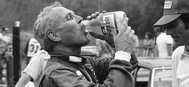 Driver-actor Paul Newman takes a long cool drink before mounting the victory stand at Lime Rock Park race track in Lime Rock on Saturday, July 6, 1980. Newman had just finished driving his Datsun 280ZX race at the Connecticut track. (AP Photo/Robert Child)