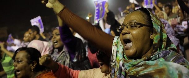 Sudanese anti-government protesters chant slogans during a demonstration in Khartoum, Sudan, Sunday, Sept. 29, 2013. Thousands of Sudanese protesters took to the streets in night march in the capital Khartoum late Sunday. (AP Photo/Khalil Hamra)