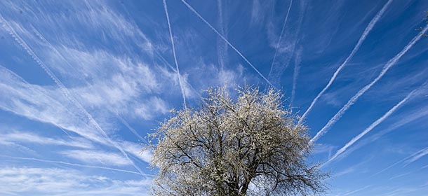 Contrails draw through the blue sky on April 15, 2013 in Hanau near Frankfurt am Main, western Germany. Meteorologists forecast sunshine and temperatures reaching up to 20 degrees Celsius and even more for wide parts of the country. AFP PHOTO / NICOLAS ARMER / GERMANY OUT (Photo credit should read Nicolas Armer/AFP/Getty Images)