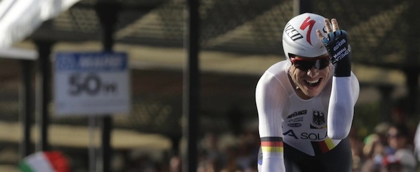 German cyclist Tony Martin celebrates as he crosses the finish line to win the gold medal in the men's individual time trial event at the road cycling world championships, in Florence, Italy, Wednesday, Sept. 25, 2013. (AP Photo/Luca Bruno)
