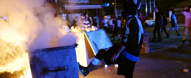 A protestor pushes a barricade with his foot on September 12, 2013 at Kadikoy in Istanbul. Thousands of people angry over the death of a 22-year-old demonstrator in southern Turkey on Monday clashed with police in Istanbul, the capital Ankara, the western city of Izmir as well as in the southern cities of Mersin and Atakya. AFP PHOTO/BULENT KILIC (Photo credit should read BULENT KILIC/AFP/Getty Images)