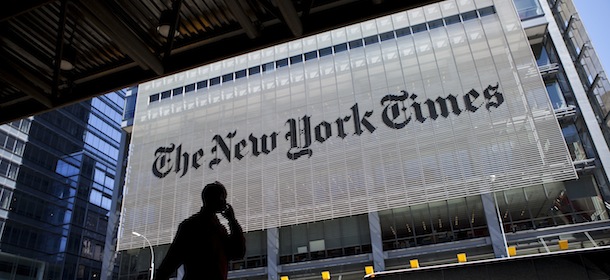 NEW YORK &#8211; APRIL 21: A man speaks on his mobile phone across from The New York Times headquarters building April 21, 2011 in New York City. The New York Times profits fell 58 percent in the first quarter of 2011. (Photo by Ramin Talaie/Getty Images)
