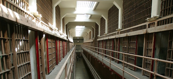 A National Park Service ranger walks down "Broadway" in the main cell block on Alcatraz Island, 14 June 2007 in San Francisco Bay of California. Sometimes referred to as "The Rock", the island of Alcatraz served first as a military fortification, before it became a federal penitentiary in 1934. Now Alcatraz is national recreation area under the supervision of the Naitonal Park Service (NPS) with more than a million visitors a year taking the short ferry ride from San Francisco's Fisherman's Wharf to experience the infamous maximum-security prison for high-risk convicts. Famous island residents have included "Machine Gun" Kelly, Al Capone and Robert "Birdman" Stroud. AFP PHOTO / Robyn BECK (Photo credit should read ROBYN BECK/AFP/Getty Images)