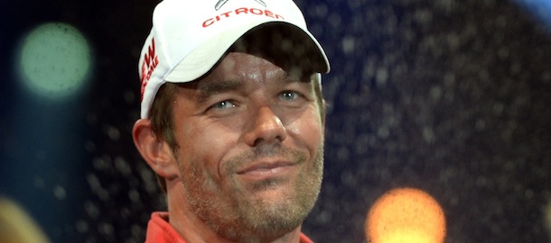 France's driver Sebastien Loeb reacts during a ceremony at the end of France's WRC Rally on October 6, 2013 in Strasbourg, eastern France. AFP PHOTO / PATRICK HERTZOG (Photo credit should read PATRICK HERTZOG/AFP/Getty Images)