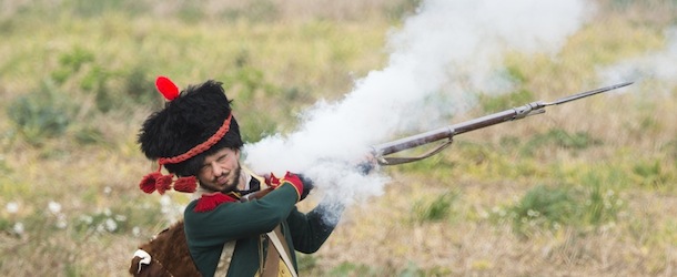 A French soldier fires his weapon during a re-enactement of the Battle of the Nations (Voelkerschlacht) in Leipzig, eastern Germany, on October 20, 2013. This year&#8217;s re-enactement marks the battle&#8217;s 200th anniversary, with 6000 enthusiasts taking part. The battle, between the remnants of Napoleon&#8217;s Grande Armee and a Russo-Prussian coalition, was Napoleon&#8217;s most crushing defeat. AFP PHOTO / JOHN MACDOUGALL (Photo credit should read JOHN MACDOUGALL/AFP/Getty Images)
