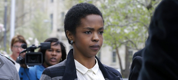 FILE - An April 22, 2013, file photo shows singer Lauryn Hill walking from federal court in Newark, N.J. Hill has started serving a three-month prison sentence in Connecticut for failing to pay about $1 million in taxes over the past decade. The Grammy-winning singer reported Monday July 8, 2013, to the federal prison in Danbury. (AP Photo/Mel Evans, file)