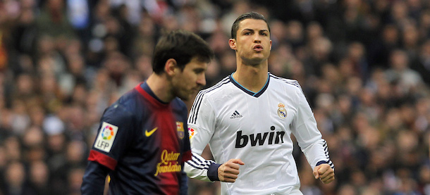 Real Madrid&#8217;s Cristiano Ronaldo from Portugal, right, and FC Barcelona&#8217;s Lionel Messi from Argentina, left, gesture during a Spanish La Liga soccer match at the Santiago Bernabeu stadium in Madrid, Spain, Saturday, March 2, 2013. (AP Photo/Andres Kudacki)
