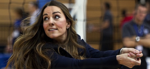 Britain&#8217;s Kate, The Duchess of Cambridge plays volleyball during a visit to a SportsAid Athlete Workshop, at the Queen Elizabeth Olympic Park in London, Friday, Oct. 18, 2013. The Duchess of Cambridge as Patron of SportsAid attended a SportsAid Athlete Workshop at the Copper Box where she viewed young athletes taking part in a number of sports activities. (AP Photo/David Bebber, Pool)
