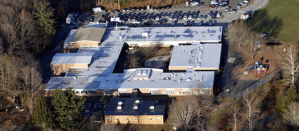 FILE - This Dec. 14, 2012 aerial file photo shows Sandy Hook Elementary School in Newtown, Conn., where a gunman shot 27 people dead, including 20 children. A task force of elected officials in Newtown on Friday, May 10, 2013 recommended tearing down the school and rebuilding on the same site. (AP Photo/Julio Cortez, File)