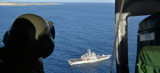 LAMPEDUSA, ITALY - OCTOBER 09: Images taken from a AB412 helicopter with the Second Regiment SIRIO of the Italian Army
show Italian Navy ships and the Coast Guard units taking part in a search and rescue operation near the coast of the Italian island of Lampedusa for the victims of Thursday's migrant boat-wreck tragedy on on October 9, 2013 in Lampedusa, Italy. Italy is to hold a state funeral for the migrants who died after their boat capsized close to the island. It is thought at least 274 people died and divers are still trying to recover the remainder of the bodies. (Photo by Tullio M. Puglia/Getty Images)