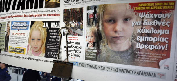 ATHENS, GREECE &#8211; OCTOBER 21: People walk past newspapers on a stand which feature front pages reporting on the story a four-year-old girl reportedly named Maria, who was found living with a Roma couple in central Greece, on October 21, 2013 in Athens, Greece. The Roma couple are due to appear in court today in Larissa, Greece, on charges of abducting the young girl, who was found on Wednesday October 16th, 2013, at a Roma settlement near Farsala in central during a police raid of the area for suspected drug trafficking. (Photo by Milos Bicanski/Getty Images)
