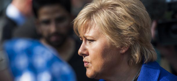Norway's main opposition leader Erna Solberg, of the Hoyre party answers questions during a press meeting in front of the Parliament building in Oslo Saturday, Sept. 7, 2013, the day before general elections in Norway. (AP Photo/NTB Scanpix, Fredrik Varfjell) NORWAY OUT