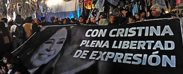People celebrate in front of the Argentinian Congress building with a banner reading &#8220;With Cristina full freedom of expression&#8221; referring to Argentine President Cristina Fernandez de Kirchner, during a demonstration in Buenos Aires on October 29, 2013. Argentina&#8217;s Supreme Court upheld as constitutional a controversial law that would force the country&#8217;s largest media group, Clarin, to divest some of its units. Clarin, which has been locked in conflict with President Cristina Kirchner, had challenged the validity of the media law, passed four years ago by the Argentine Congress. AFP PHOTO / DANIEL GARCIA (Photo credit should read DANIEL GARCIA/AFP/Getty Images)
