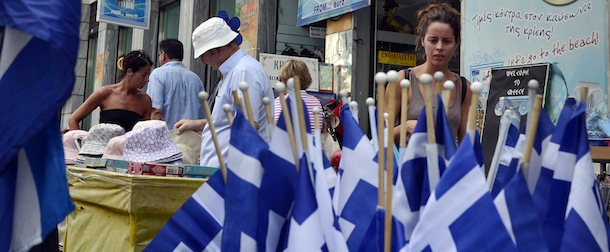 People look at goods at a shop in central Athens on August 22, 2013. ECB board member Joerg Asmussen said Wednesday that Europe would consider additional aid to Greece if Athens makes progress on cutting its budget deficit and meets all the terms of its bailout deal. .AFP PHOTO / LOUISA GOULIAMAKI (Photo credit should read LOUISA GOULIAMAKI/AFP/Getty Images)