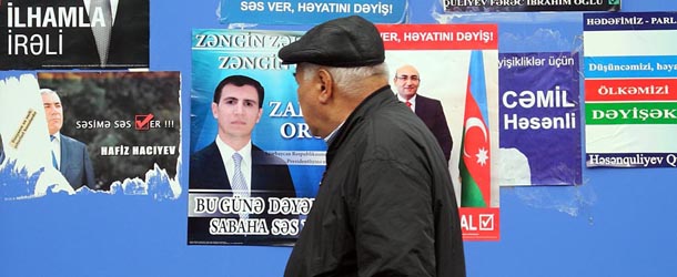 A man walks past a board plastered with campaign posters of presidential contenders in Baku, the capital of Azerbaijan, on October 7, 2013, ahead of the upcoming presidential elections. This week the predominantly Muslim nation of Azerbaijan holds presidential elections, where incumbent Ilham Aliyev, who took over in 2003 after the death of his father Heydar, a former KGB officer and Communist-era boss, claims a third term. AFP PHOTO/ TOFIK BABAYEV (Photo credit should read TOFIK BABAYEV/AFP/Getty Images)