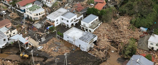 An aerial view shows collapsed houses following a landslide caused by Typhoon Wipha on Izu Oshima island, south of Tokyo, in this photo taken by Kyodo October 16, 2013. Four people were reported killed, schools closed, hundreds of flights cancelled and thousands were advised to evacuate as Typhoon Wipha pummelled Tokyo on Wednesday, although the Japanese capital escaped major damage. Mandatory Credit. REUTERS/Kyodo (JAPAN - Tags: DISASTER ENVIRONMENT) ATTENTION EDITORS - THIS IMAGE HAS BEEN SUPPLIED BY A THIRD PARTY. IT IS DISTRIBUTED, EXACTLY AS RECEIVED BY REUTERS, AS A SERVICE TO CLIENTS. FOR EDITORIAL USE ONLY. NOT FOR SALE FOR MARKETING OR ADVERTISING CAMPAIGNS. MANDATORY CREDIT. JAPAN OUT. NO COMMERCIAL OR EDITORIAL SALES IN JAPAN. YES