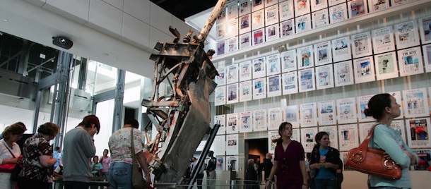 Visitors tour the September 11, 2001 gallery, including a piece of the radio tower from the top of the North Tower of the World Trade Center and front-pages of newspapers from around the world at the Newseum, a 250,000 square-foot museum dedicated to news, on its opening day in Washington, DC, on April 11, 2008. AFP PHOTO/SAUL LOEB (Photo credit should read SAUL LOEB/AFP/Getty Images)
