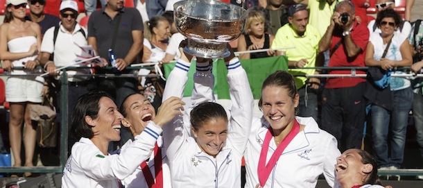 Italy&#8217;s, from left, Francesca Schiavone, Flavia Pennetta, Sara Errani, Karin Knapp and Roberta Vinci celebrate with the trophy after winning the Fed Cup tennis final match against Russia, in Cagliari, Italy, Saturday, Nov. 3, 2013. Italy won a fourth Fed Cup title with a whitewash 4-0 victory over Russia on Sunday as seventh-ranked Sara Errani cruised past Alisa Kleybanova before Flavia Pennetta and Karin Knapp won the dead doubles rubber. (AP Photo/Max Solinas)
