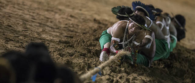 AP10ThingsToSee - Gaviao Indians participate in a tug of war competition during the indigenous games in Cuiaba, Brazil, Wednesday, Nov. 13, 2013. Around 1,600 Indians from 48 tribes are celebrating Brazil's indigenous cultures during the 12th edition of the Games of the Indigenous People, which runs until Nov. 16. (AP Photo/Felipe Dana, File)