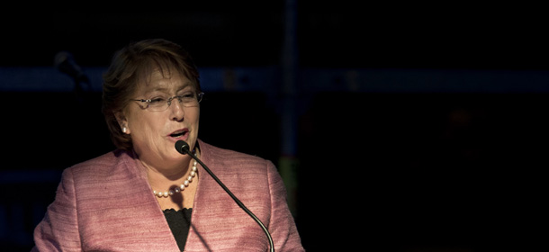 Chilean presidential candidate for the New Majority coalition, Michelle Bachelet, delivers a speech at the party's headquarters in Santiago, on November 17, 2013, after general elections. Bachelet won a first round of Chile's presidential race Sunday, with 46,74% of the votes, and will go to a runoff election with the presidential candidate for the ruling coalition Evelyn Matthei next December 15. AFP PHOTO/MARTIN BERNETTI (Photo credit should read MARTIN BERNETTI/AFP/Getty Images)