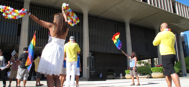 Gay marriage supporters rally outside the Hawaii Capitol in Honolulu ahead of a Senate vote on whether to legalize same-sex marriage on Tuesday, Nov. 12, 2013. (AP Photo/Oskar Garcia)
