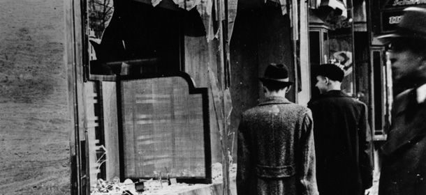 10th November 1938: Three onlookers at a smashed Jewish shop window in Berlin following riots of the night of 9th November. (Photo by Hulton Archive/Getty Images)
