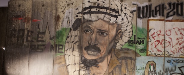 A picture shows a mural of late Palestinian leader Yasser Arafat on a section of Israel&#8217;s controversial separation barrier in the West Bank&#8217;s Qalandia refugee camp, near Ramallah, on November 6, 2013. Swiss scientists have concluded Palestinian leader Yasser Arafat is likely to have died from polonium poisoning, according to a text of their findings published by Al-Jazeera television. AFP PHOTO /AHMAD GHARABLI (Photo credit should read AHMAD GHARABLI/AFP/Getty Images)
