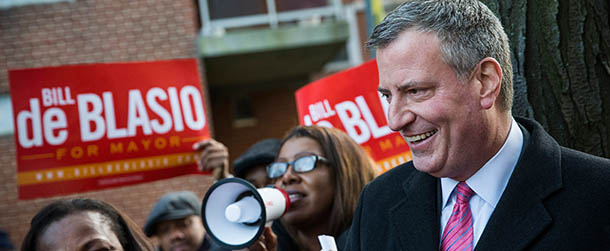 NEW YORK, NY &#8211; NOVEMBER 04: New York City Mayoral candidate Bill De Blasio speaks to campaign supporters in a public housing village on November 4, 2013 in the Queens borough of New York City. De Blasio is considered the strong frontrunner as New York City voters go to the polls tomorrow to vote for the next mayor. (Photo by Andrew Burton/Getty Images)
