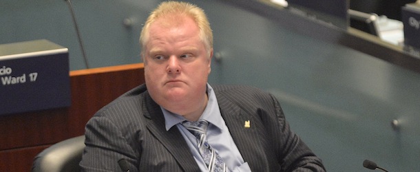 Toronto Mayor Rob Ford sits during a City council meeting at Toronto City Hall on Tuesday May 21, 2013. Ford ignored a crush of reporters waiting outside his city hall office this morning in the hopes he would address allegations that he was recorded on video appearing to smoke crack cocaine. (AP Photo/THE CANADIAN PRESS/Nathan Denette)
