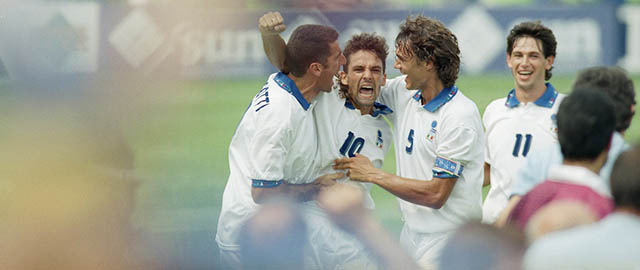 Italian soccer player Roberto Baggio (10) jubilates with teammates after scoring the first of his two goals, tying the game for Italy in their second round World Cup soccer match against Nigeria, Tuesday, July 5, 1994 at Foxboro Stadium in Foxboro, Mass. Italy defeated Nigeria 2-1 to advance to the quarterfinals against Spain Saturday, July 9 at Foxboro. Joining in are Mauro Tassotti, left, and Paolo Maldini (5). (AP Photo/Elise Amendola)