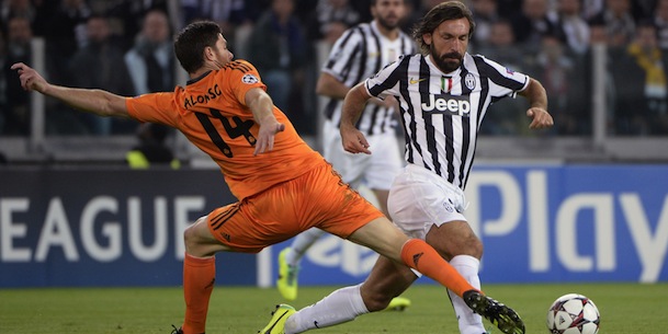 Juventus midfielder Andrea Pirlo (R) fights for the ball with Real Madrid midfielder Xabi Alonso on November 5, 2013 during a UEFA Champions League Group B football match at the Juventus stadium in Turin. AFP PHOTO / OLIVIER MORIN (Photo credit should read OLIVIER MORIN/AFP/Getty Images)
