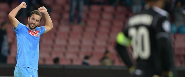 Napoli&#8217;s Argentinian forward Gonzalo Higuain celebrates after scoring a goal during an UEFA Champions League group F football match between SSC Napoli and Olympique de Marseille at the San Paolo Stadium in Naples on November 6, 2013. AFP PHOTO / GABRIEL BOUYS (Photo credit should read GABRIEL BOUYS/AFP/Getty Images)
