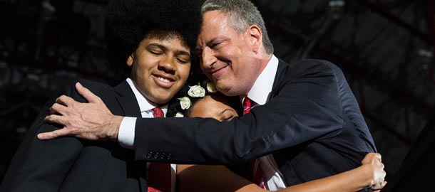 NEW YORK, NY &#8211; NOVEMBER 05: Newly elected New York City Mayor Bill de Blasio (R) hugs his son Dante de Blasio (L) and daughter Chiara de Blasio at his election night party on November 5, 2013 in New York City. De Blasio beat out Republican candidate Joe Lhota and will succeed Michael Bloomberg as the 109th mayor of New York City. He is the first Democratic mayor in 20 years. (Photo by Andrew Burton/Getty Images)

