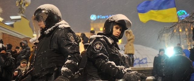 Riot police stand guard around Kiev's Independence Square on December 9, 2013. Ukrainian police forced protesters who have blockaded the government headquarters in central Kiev for a week to move away from the building. A column of special troops moved in on the protestors to force them to leave, upon which opposition MPs urged the demonstrators to move down the street to Independence Square, the main protest venue. AFP PHOTO / GENYA SAVILOV (Photo credit should read GENYA SAVILOV/AFP/Getty Images)