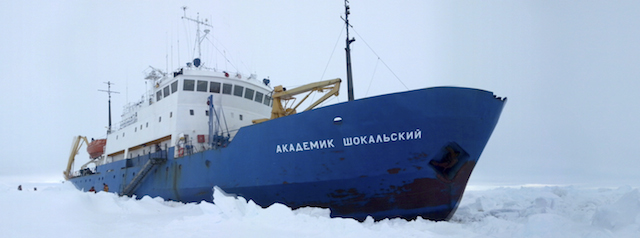 In this image provided by Australasian Antarctic Expedition, Russian ship MV Akademik Shokalskiy is trapped in thick Antarctic ice 1,500 nautical miles south of Hobart, Australia, Friday, Dec. 27, 2013. The research ship, with 74 scientists, tourists and crew on board, has been on a research expedition to Antarctica, when it got stuck Tuesday after a blizzard's whipping winds pushed the sea ice around the ship, freezing it in place. (AP Photo/Australasian Antarctic Expedition, Chris Turney) EDITORIAL USE ONLY