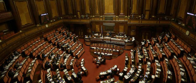A general view of the Italian Senate prior to the start of a vote that might kick Silvio Berlusconi out of the Parliament because of his tax fraud conviction, in Rome Wednesday, Nov. 27, 2013. Berlusconi was convicted last year over the purchase of rights to broadcast U.S. movies on his Mediaset empire through a series of offshore companies that involved the false declaration of payments to avoid taxes. Italy's high court upheld the conviction and four-year prison sentence on Aug. 1. The Senate vote is based on a 2012 law that bans anyone sentenced to more than two years in prison from holding or running for public office for six years. (AP Photo/Gregorio Borgia)