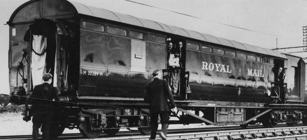 Here are the two coaches of the Glasgow-London mail train which a gang of masked men robbed of more than 100 bags of registered mail near Cheddington, England on August 8, 1963. One official said the haul could total as high as 2.6 million pounds -- estimated worth of $3.7 million dollars. The bandits stopped the train at a rural crossing 40 miles northwest of London, uncoupled these two coaches, drove them a mile further and unloaded the bags to a waiting truck. (AP Photo)