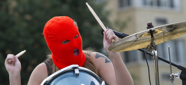The punk band, "Jail Solidarity, performs during a punk concert protest against the prison sentences of the Russian band Pussy Riot, as well as show support for human rights in Russia, across the street from the Russian Embassy in Washington, DC, August 16, 2013. The event, sponsored by Amnesty International, supports the band members that are currently serving sentences in Russian penal colonies for a protest inside a Moscow Cathedral, as well support the LGBT community in Russia following actions by the Russian government to curtail public protests and acts of free expression. AFP PHOTO / Saul LOEB (Photo credit should read SAUL LOEB/AFP/Getty Images)