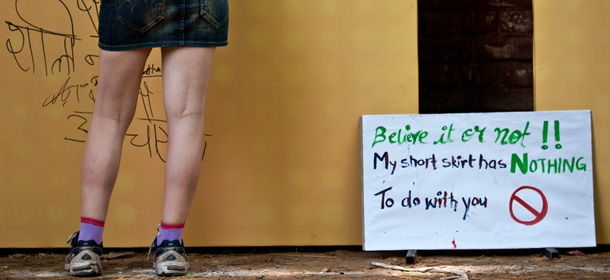 A female participant of the "Slut Walk" writes a message on a board in New Delhi on July 31, 2011 during a protest against sexual harassment of women. Hundreds of women and men marched to join the country's first "Slut Walk", a protest against the alarming rise in sexual assault cases and to curb the growing sense of insecurity among women. AFP PHOTO/ MANAN VATSYAYANA (Photo credit should read MANAN VATSYAYANA/AFP/Getty Images)