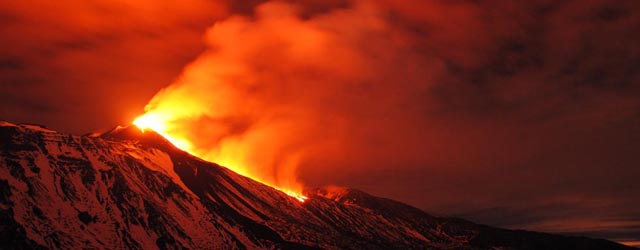 The South East Crater of Mt. Etna erupts as seen from the Schiena dell'Asino, near Catania, in Sicily, southern Italy, early Monday, Dec. 30, 2013. Mt. Etna erupts quite frequently, the last eruption occurred a couple of weeks ago, causing no damages. (AP Photo/Salvatore Allegra)