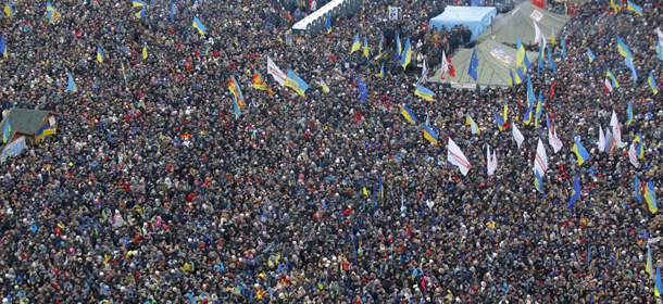 Pro-European Union activists gather during a rally in Independence Square in Kiev, Ukraine, Sunday, Dec. 15, 2013. About 200,000 anti-government demonstrators converged on the central square of Ukraineís capital Sunday, a dramatic demonstration that the oppositionís morale remains strong after nearly four weeks of daily protests. (AP Photo/Sergei Grits)