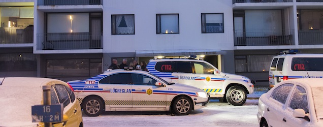 Police officers park at a house where a man was shot dead by poilce in ReykjaiÌk on December 2, 2013. It was the first-ever armed police operation, officials said. With a population of only 322,000 and one of the lowest crime rates in the world, police rarely draw their weapons in the island nation. The incident was "without precedent" in Iceland's history, national police chief Haraldur Johannessen told a press conference in Reykjavik. AFP PHOTO / HALLDOR KOLBEINS (Photo credit should read HALLDOR KOLBEINS/AFP/Getty Images)