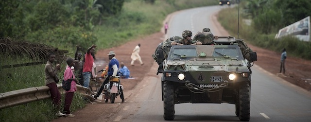 French militaries stand on a road to Central African Republic, on December 5, 2013. A UN Security Council resolution on Thursday gave French and African troops the green light to restore order in the Central African Republic, the latest in a string of military campaigns by France in its former colony. AFP PHOTO / FRED DUFOUR (Photo credit should read FRED DUFOUR/AFP/Getty Images)