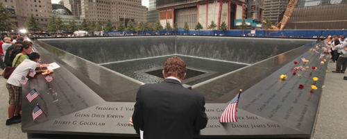 Michael Lehrman, Executive Managing Director of Cantor Fitzgerld and Co., bows his head at the names of some of the over 600 employees from Cantor Fitzgerald who lost their lives in the 2001 terrorist attacks, Sunday, Sept. 11, 2011. Sunday marked the 10th anniversary of the terrorist attacks on the World Trade Center. (AP Photo, Carolyn Cole, Pool)