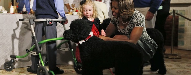 First lady Michelle Obama xxx military families in the xxx Room at the White House in Washington, Wednesday, Dec. 4, 2013, as she invites them to tour the 2013 Christmas decorations. (AP Photo/Charles Dharapak)