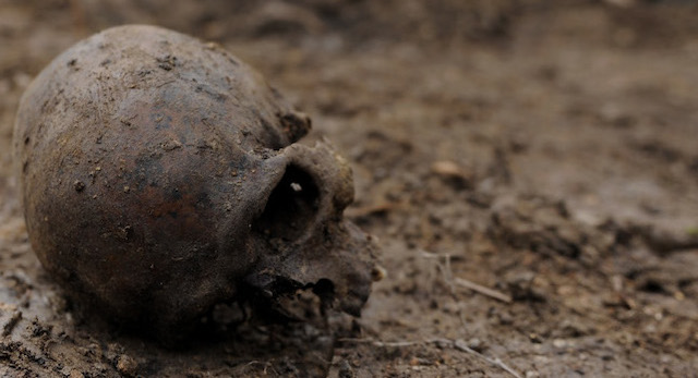 Members of a Russian team that looks for the remains of Red Army soldiers killed while fighting against Nazi Germany’s forces during World War II excavate the remains of what is thought to be a soldier found in the woods north of Novgorod on May 3, 2011. The remains were partially buried and will be transferred to a labratory for identification. AFP PHOTO / MIKHAIL MORDASOV (Photo credit should read MIKHAIL MORDASOV/AFP/Getty Images)