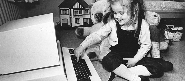 8th May 1980: Four-year-old Antonia Salmon with one of her birthday presents,a computer which used to belong to her father. (Photo by Hulton Archive/Getty Images)