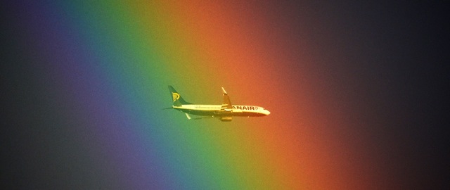 A plane of the Irish low cost company Ryanair flies in front of a rainbow over Rome on January 19, 2014. AFP PHOTO / GABRIEL BOUYS (Photo credit should read GABRIEL BOUYS/AFP/Getty Images)