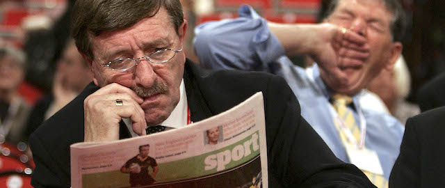 BRIGHTON, UNITED KINGDOM - SEPTEMBER 28: A man reads the sports section of a newspaper as another yawns during a debate at the Labour Party conference on September 28, 2005 in Brighton, England. The governing Labour Party is holding it's yearly conference at the English coastal resort until 29 September, 2005. (Photo by Peter Macdiarmid/Getty Images)
