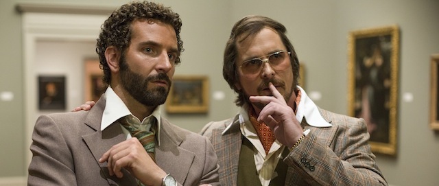 This film image released by Sony Pictures shows Bradley Cooper, left, and Christian Bale in a scene from "American Hustle." (AP Photo/Sony - Columbia Pictures, Francois Duhamel)